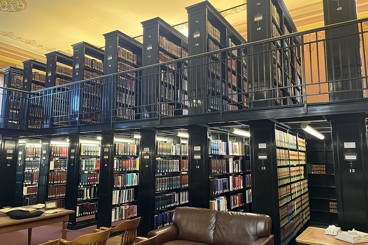 Bound law reports lining the shelves of a court law library